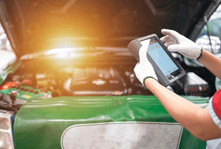 A mechanic working on a car