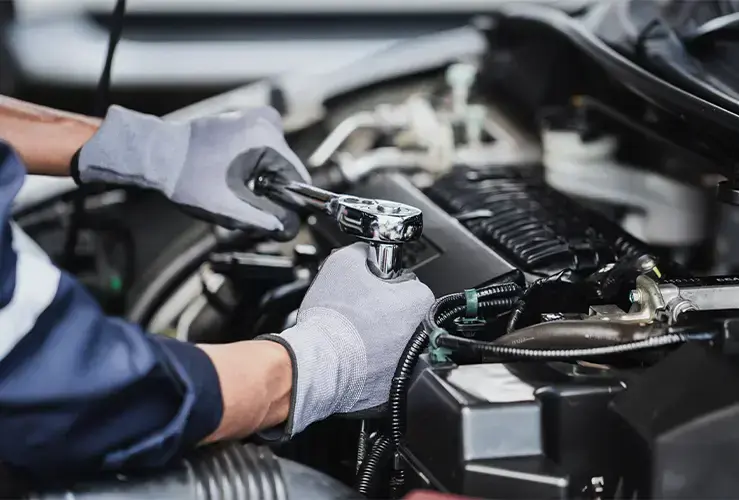 A mechanic working on a car