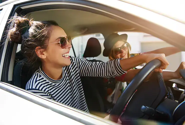 Two friends driving in a car
