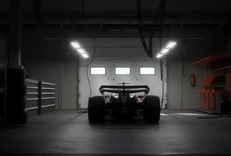 A silhouette of a sports car in a garage