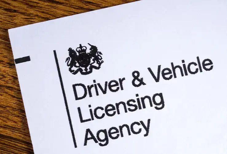 A piece of paper containing the DVLA logo
