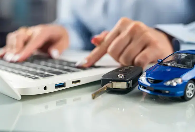 A person typing on a laptop