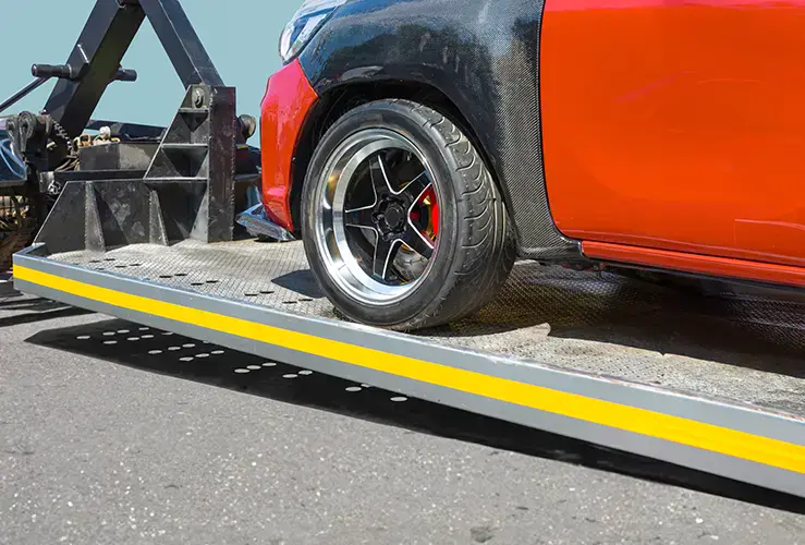 A car being towed on a tow truck