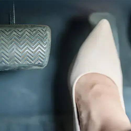 Is it illegal to drive barefoot? What's the best driving footwear?