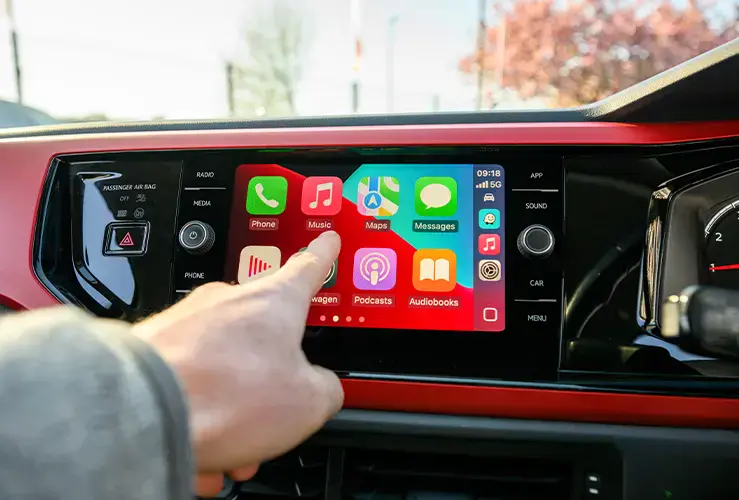 Someone using the infotainment screen in their car