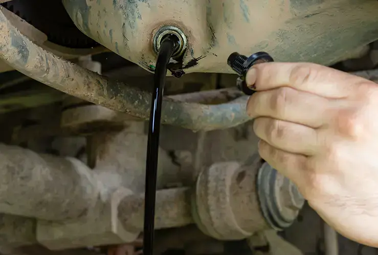 Oil draining out of a car